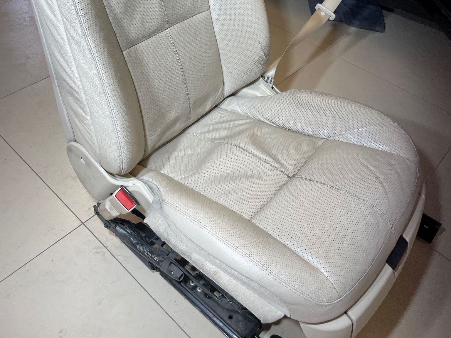 Removed front seat in light perforated leather from the Mercedes S-Class, taken out of the car for cleaning