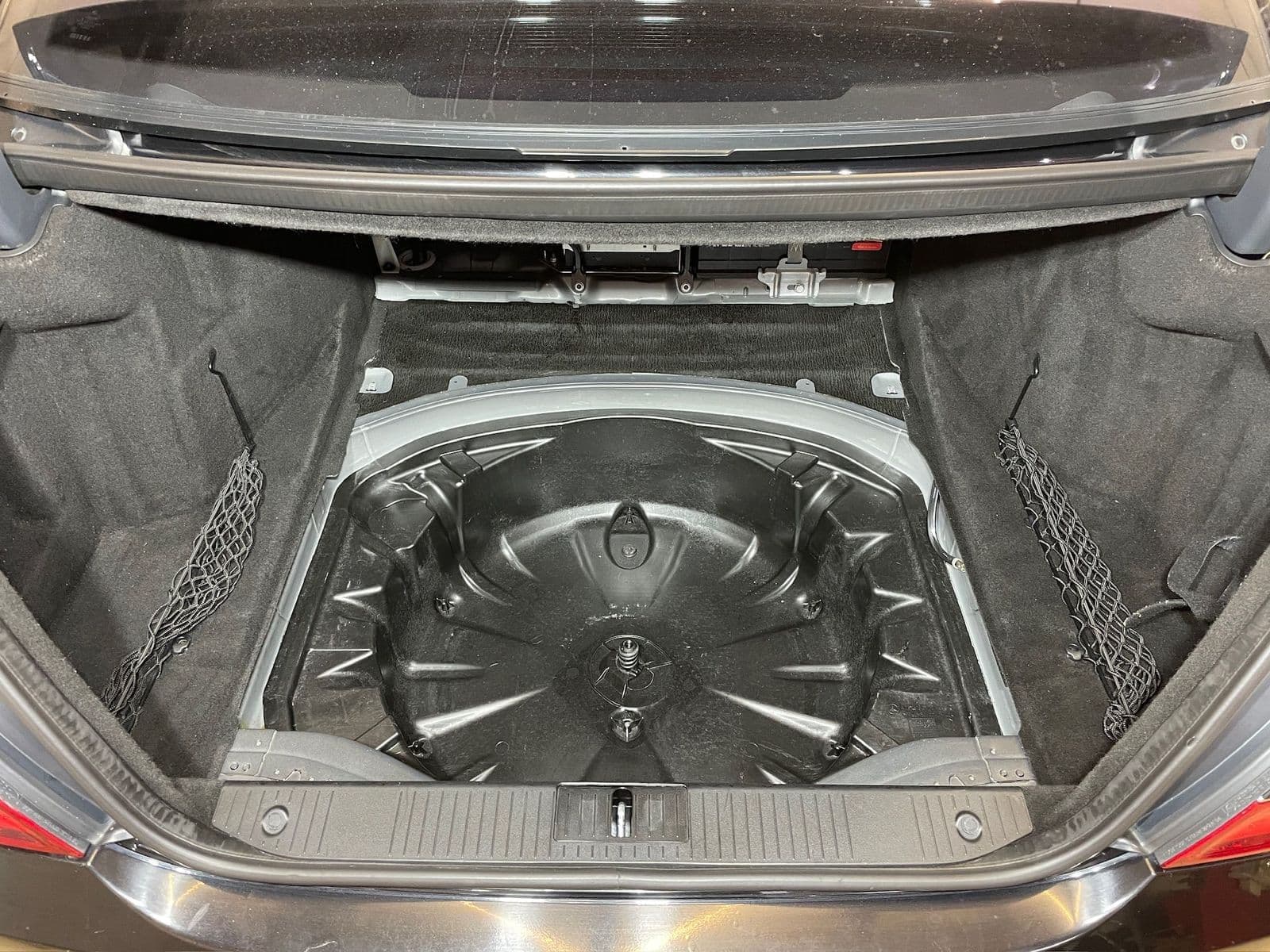 Boot of a Mercedes S-Class with the spare wheel well open